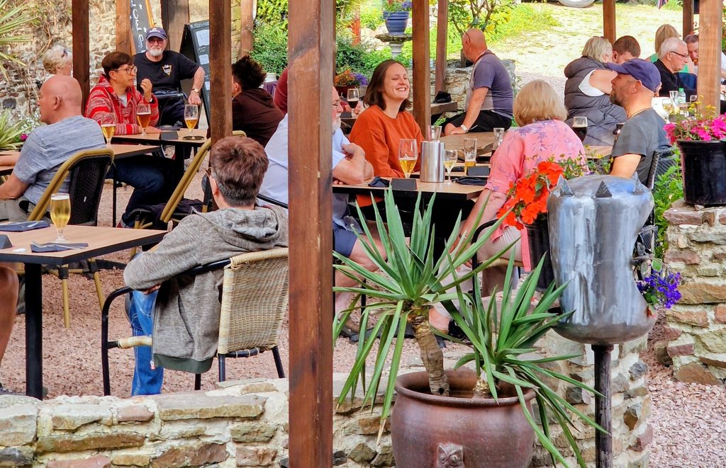 Campsite bar terrace with guests in the evening