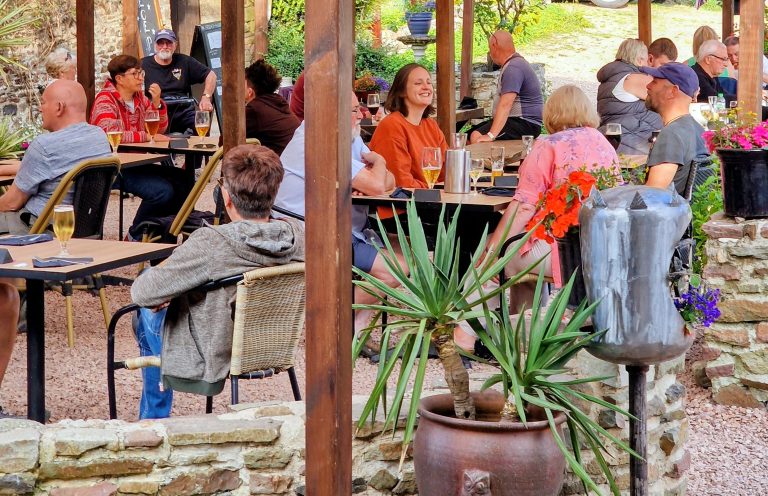 People sitting and enjoying food and drinks the terrace